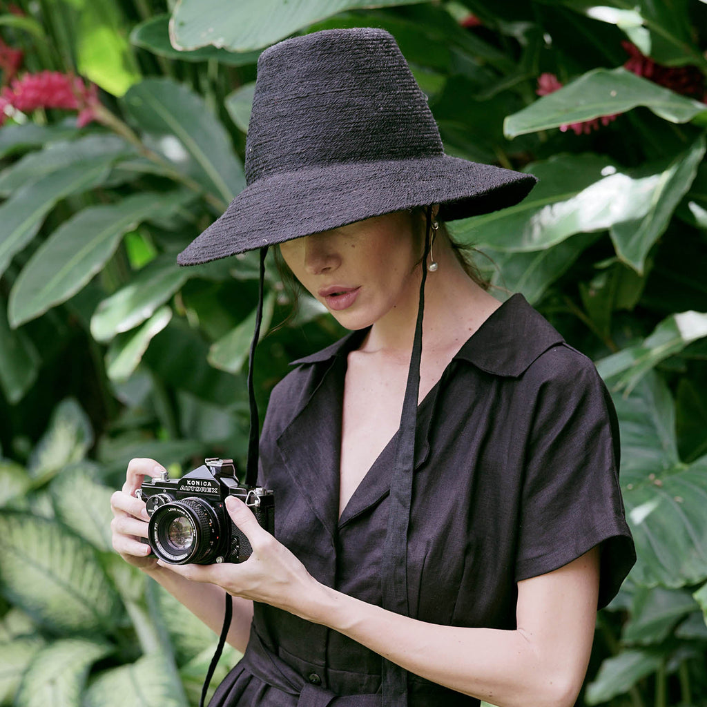 Meg Jute hat Beach Sun Hat in Black. Beautifully crafted with a tall crown shape and medium-width brim to bring back the effortless classic charm. Take this hat to your next tropical adventure or simply style up your daily grocery shop trips!