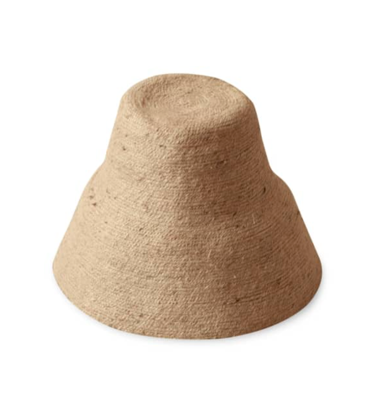 Naomi Jute Straw hat in Beige. Naomi Jute Bucket Hat is designed specifically for the wild at heart with classic sophistication. Enjoy lounging poolside or exploring the city on sun-soaked days as its protective hat brim provides ample shade. Made of natural jute straws which have the perfect weight, this hat will sit comfortably and won't fly away in sudden gusts. It's also very practical to pack in any size luggages and ideal to take on any trips.