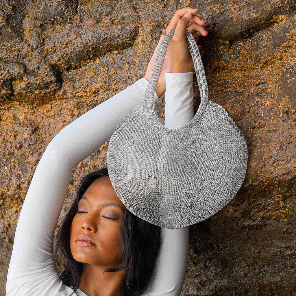 Sol Wire bag in Silver. Precious handwoven tote bag made from stainless metal wire in silver color. Made carefully by our artisans in remote villages in Bali, who create the bags from their very own homes. It is a true masterpiece.