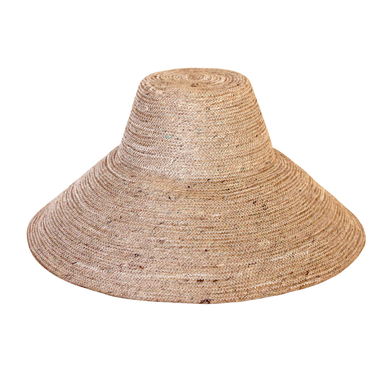 Don't be afraid of the sun. Step out in confidence with this ultra-comfortable Riri Jute woven sun hat in natural beige color. Take this artisanal hat everywhere from the sunny beachside to the hot savanna of your choice and enjoy full-on protection under the sun, while still keeping in style. This sustainable resort vacation straw hat is uniquely made by artisans in Bali.
