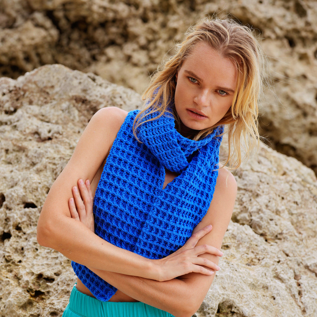 BrunnaCo's WAFFLE Crochet Scarf in Blue  has a cozy and buttery-soft texture that makes you want to wear it everywhere when the temperature gets cold. It's hand-crocheted in waffle pattern with sumptuous cotton yarn by our female artisans in Java who put so much love into this piece. Wrap it around your neck twice or let it drape loosely over the lapels of your coat.