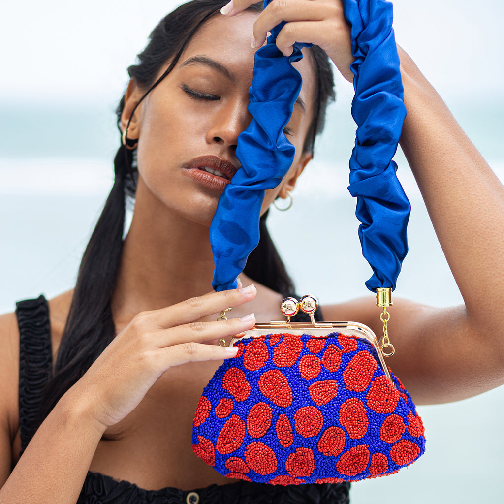BrunnaCo Arnoldi Mandy Beaded Polka Dot clutch bag in Red and Blue