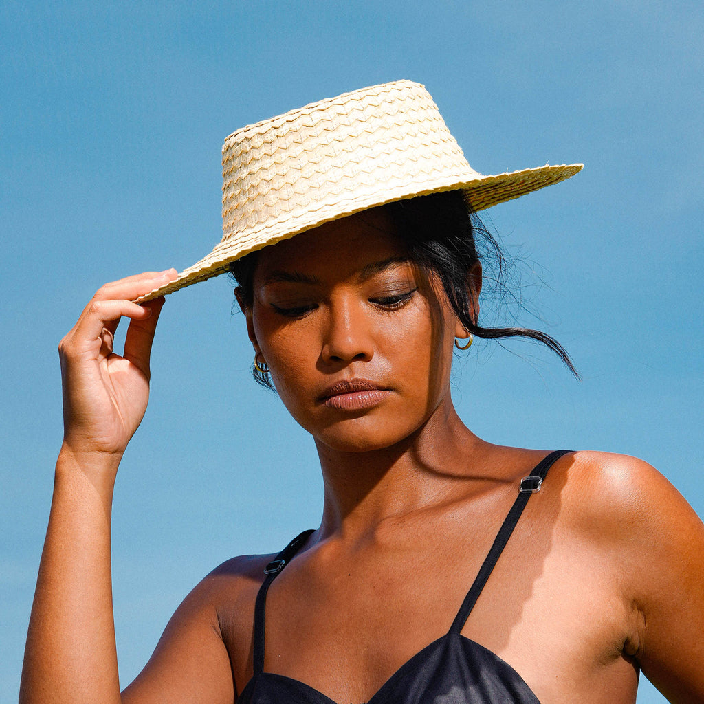 Celeste Woven Straw Hat is designed with thoughtful functionality and high-quality palm straw material sourced locally from Bali villages. This lightweight hat is thoughtfully woven by skilled artisans from remote villages is Bali who are mostly women. It is such a timeless piece, with just the right amount of personality.