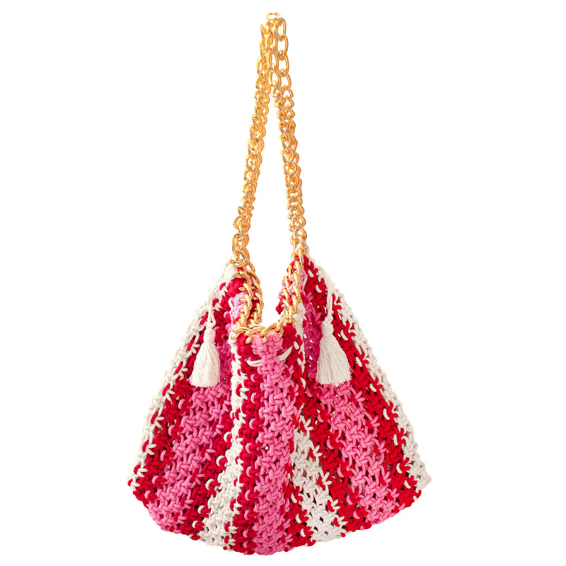 Colette macrame Tote Bag in Barbie Pink and Red. Ideal for beach holidays, COLETTE has been hand-woven from a durable cotton rope with flattering chain straps and tasseled ties. It’s just the perfect to store all your beach essentials for a care-free island getaway. Wear yours with matching separates for an effortless beach look.