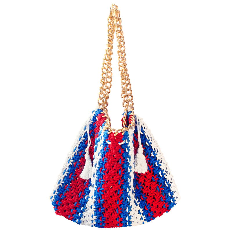 Colette Macrame Beach Tote in Red White and Blue. Ideal for beach holidays, COLETTE has been hand-woven from a durable cotton rope with flattering chain straps and tasseled ties. It’s just the perfect to store all your beach essentials for a care-free island getaway. Wear yours with matching separates for an effortless beach look.