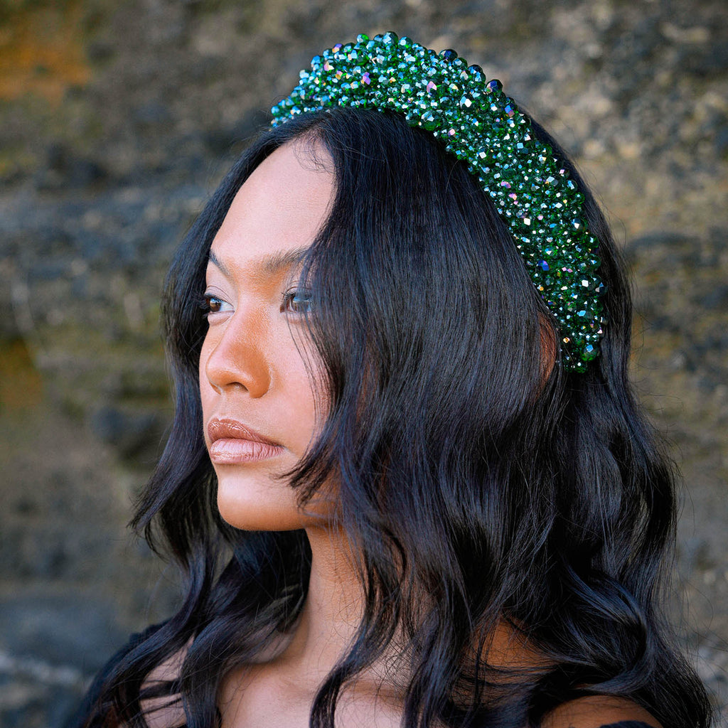 Take your look to the next level with BrunnaCo's exquisite CROWN Glass Crystal Headband. This stunning accessory features a lush emerald green color that adds a touch of sophistication to any outfit. The intricate arrangement of faceted glass beads catches the light and sparkles with every movement, making it the perfect finishing touch for any special occasion.