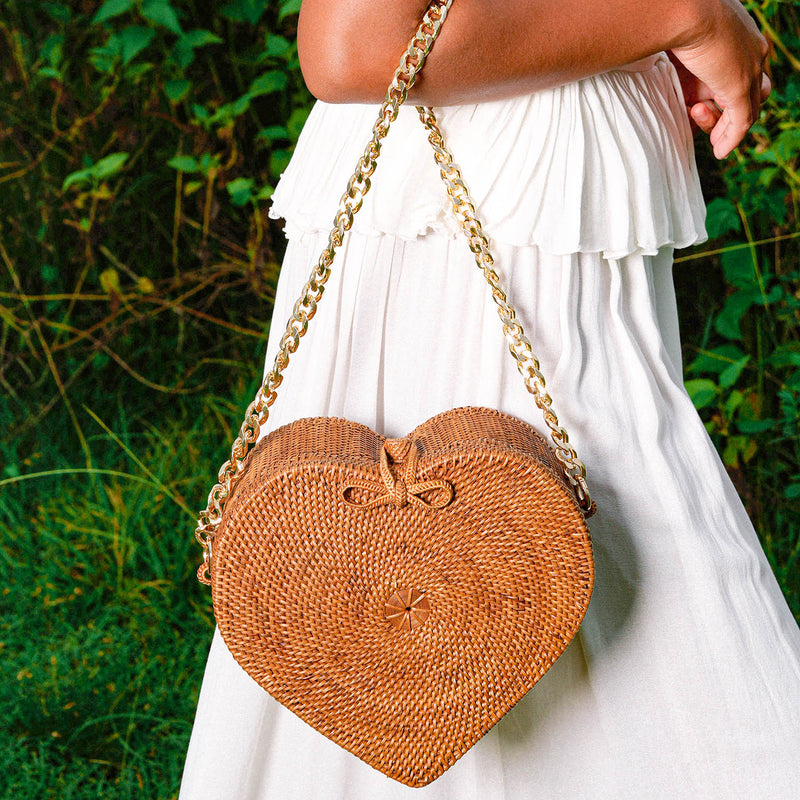 Woven from the finest Atta Rattan straws, a unique type of rattan cultivated on the East Bali and Lombok islands, CINTA Atta Rattan Shoulder bag seamlessly merges traditional crafts with modern sophistication. Each intricately woven piece is a labor of love, showcasing the unparalleled skill of Balinese artisans and their commitment to preserving authentic cultural heritage. It proudly upholds vegan values, ensuring that no animals are harmed in its creation.