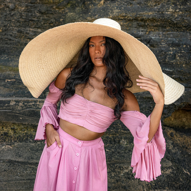 BrunnaCo SOLANA Oversized Straw Hat is a statement piece that will keep the spotlight on you while enjoying the sun. Crafted from braided natural straw, the SOLANA hat has an oversized brim guaranteed to provide full coverage from the sun’s harsh rays. Fold the brim as needed to style.