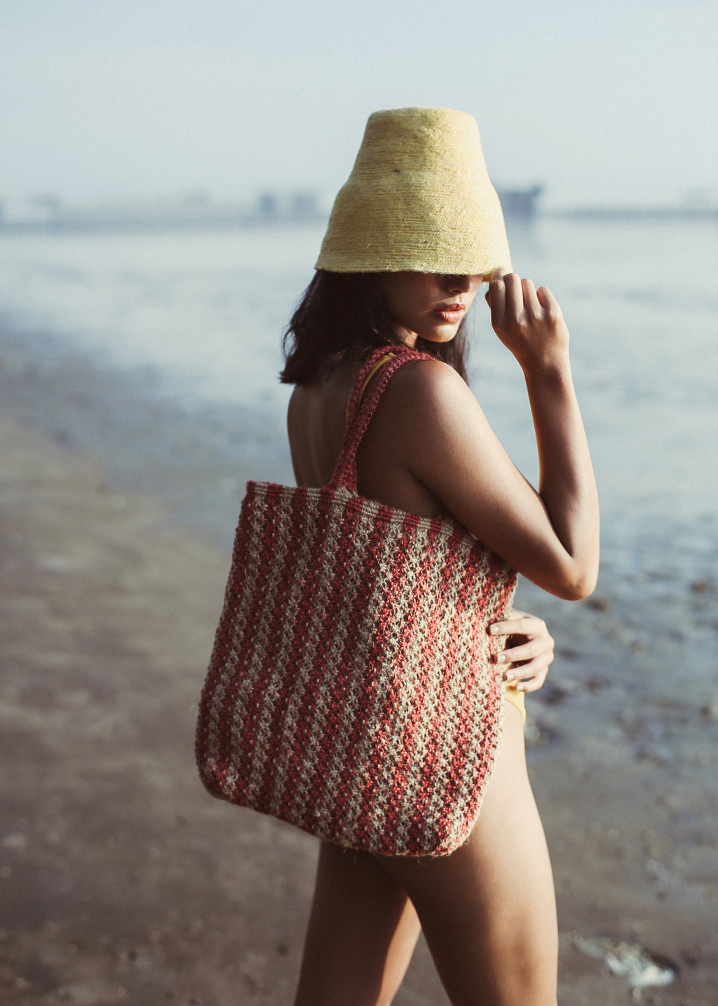 BrunnaCo Louisa Jute Tote Beach Bag. This beautiful striped tote bag in red and beige is handmade by artisans in Bali