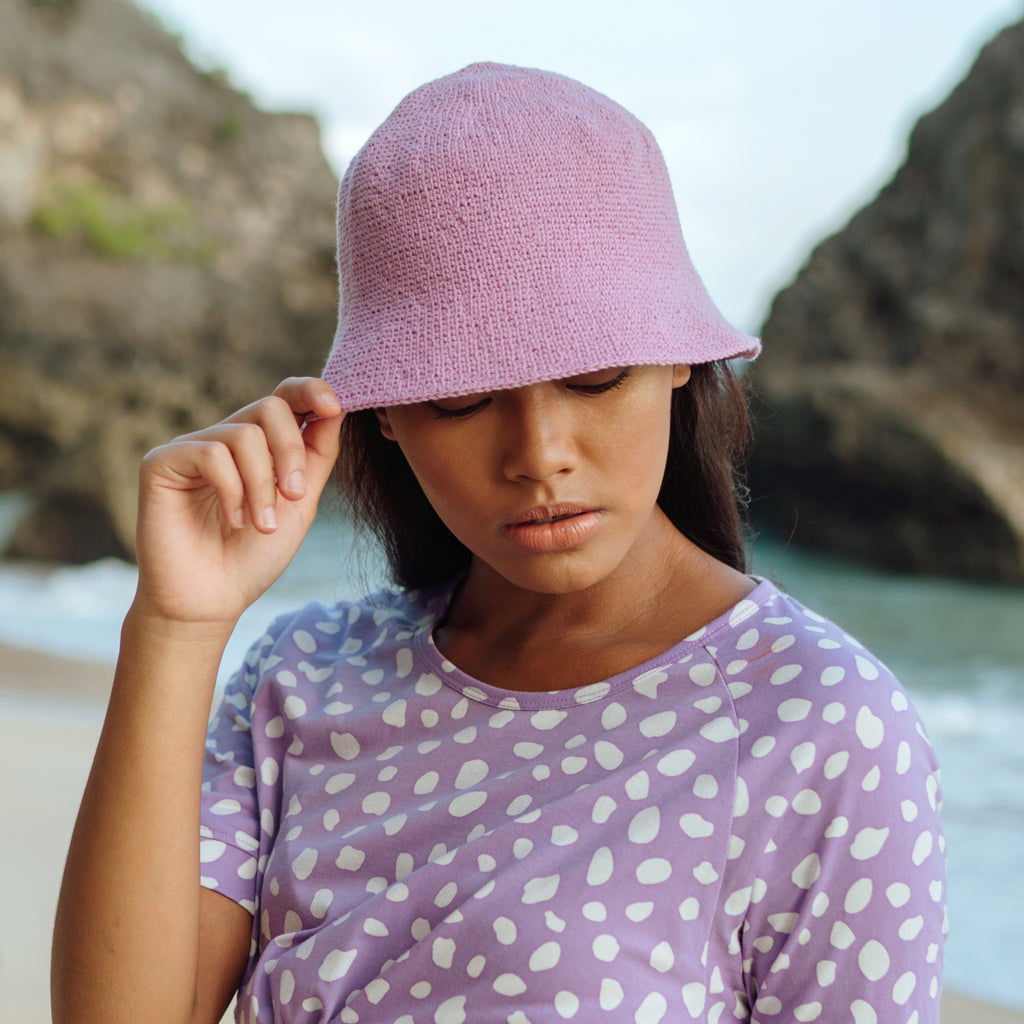 Florette Crochet Beach Bucket Hat in Lilac. Soft and shapeable crochet bucket hats meticulously made by artisans in the villages of Bali. This hat feels airy for summer days and offers irreplaceable comfort at any season of the year.