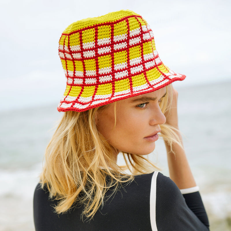 Margarita Plaid Crochet Hat. Hand-crocheted by female artisans in Java, Indonesia, this Margarita plaid crochet hat is a reminder of the beautiful feeling of being outdoor. Its fresh & tangy lime green and hot chili red color invite us to celebrate the seasons in the sun.