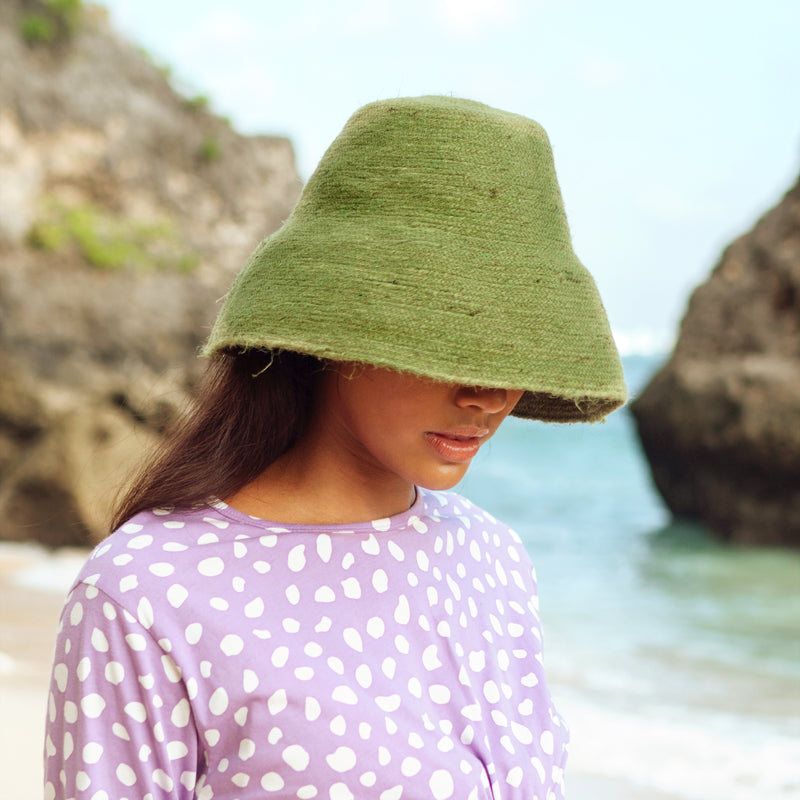 Naomi Jute Bucket Hat in Matcha Green  is designed specifically for the wild at heart with classic sophistication. Enjoy lounging poolside or exploring the city on sun-soaked days as its protective hat brim provides ample shade. Made of natural jute straws which have the perfect weight, this hat will sit comfortably and won't fly away in sudden gusts. It's also very practical to pack in any size luggages and ideal to take on any trips.