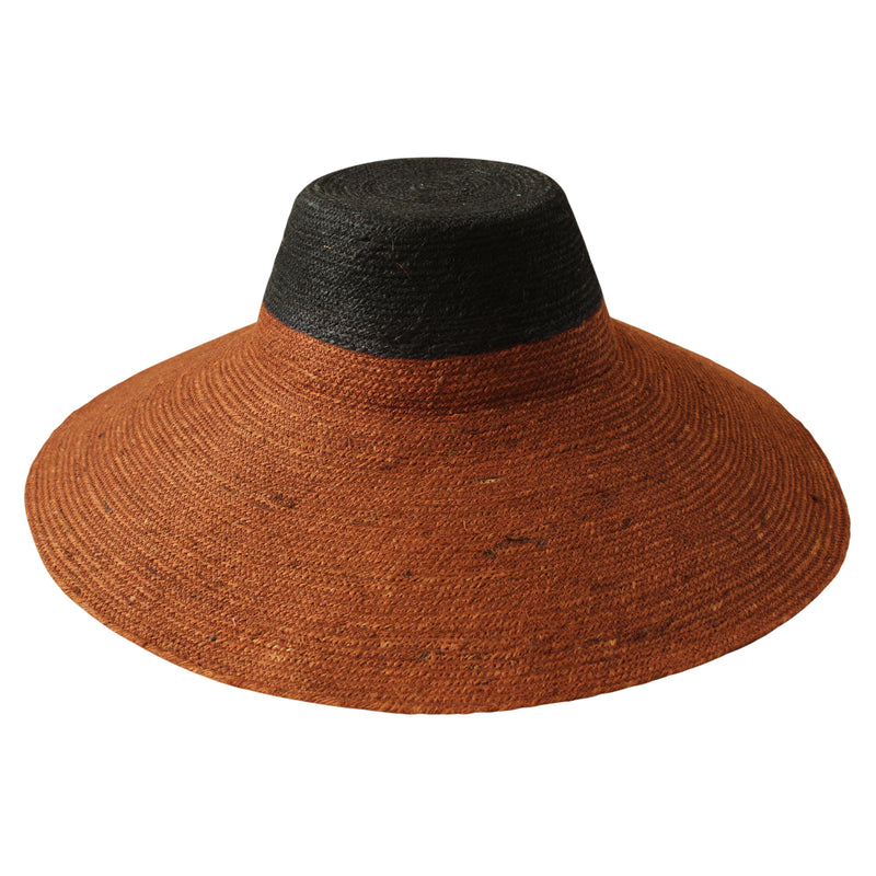 Duo color tone handwoven beach straw hat in Burnt Sienna and Black color, handmade from natural jute straw by local artisan in Bali. Handmade vacation wide-brim hat with domed down brim for maximum sun protection. Sustainably made by female artisan community in Indonesia.