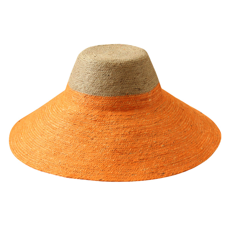 Riri Duo hat is perfect for packing on your next tropical vacation. It's made from the union of nude and tangerine orange jute colors that are bold yet versatile. Made by our female artisans in Bali from natural jute straws, it has a sculpted crown and a brim that shields from the sun.
