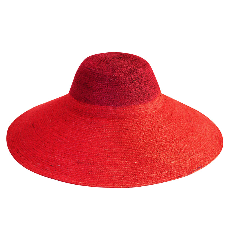 Duo color tone handwoven beach straw hat in red and maroon brim color, handmade from natural jute straw by local artisan in Bali. Handmade vacation wide-brim hat with domed down brim for maximum sun protection. Sustainably made by female artisan community in Indonesia for resort vacation season.