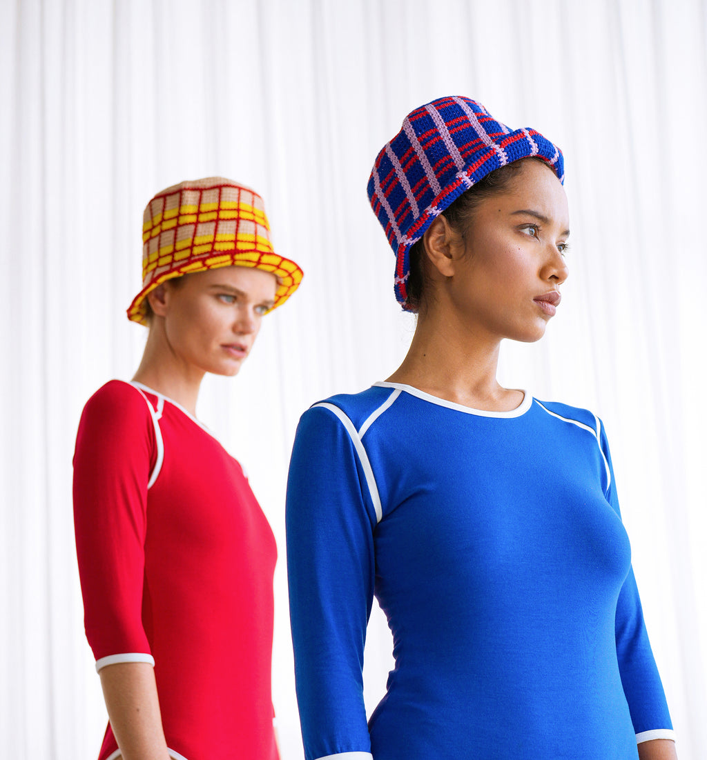 Sorority Plaid Crochet Hat. Hand-crocheted by female artisans in Java, Indonesia, SORORITY plaid crochet hat is a reminder of the beautiful feeling of being outdoors. Its fresh blue and energetic red color invites us to celebrate the seasons in the sun.