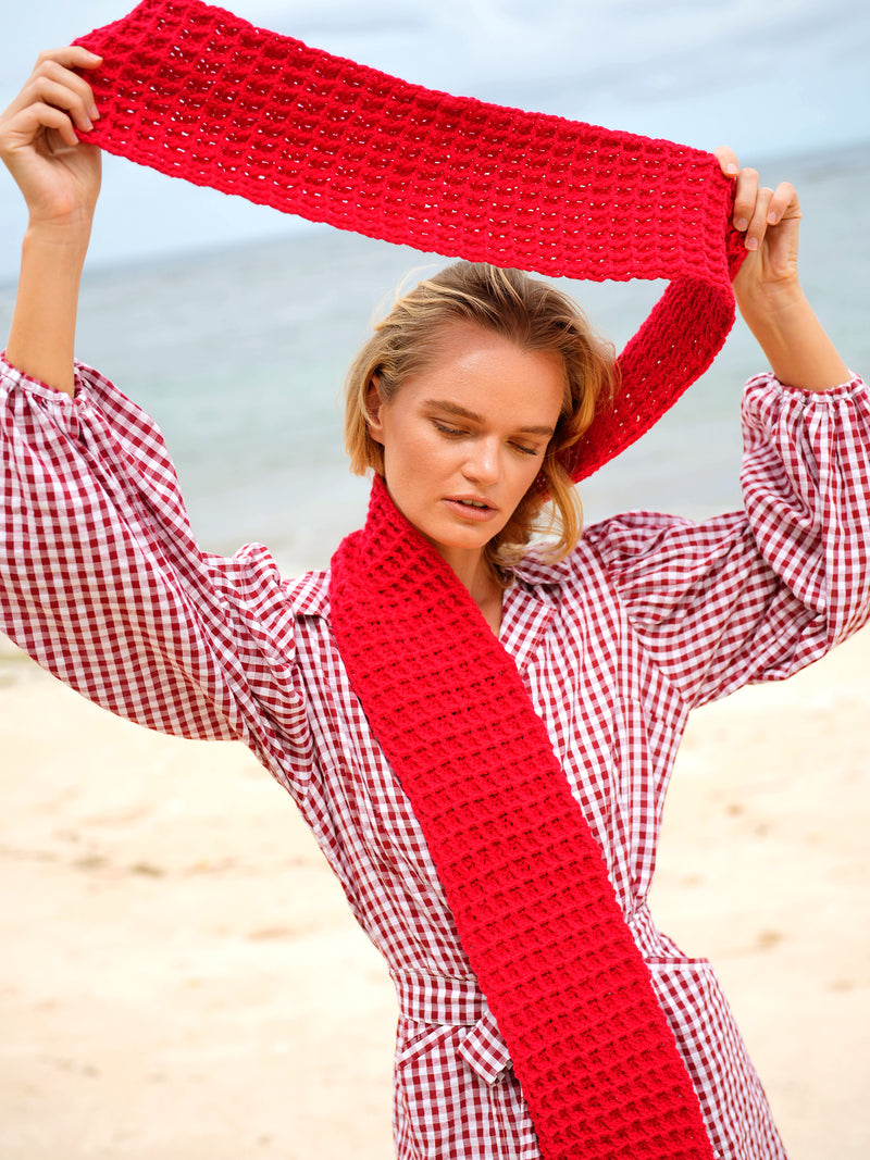BrunnaCo's WAFFLE Crochet Scarf in Scarlet Red has a cozy and buttery-soft texture that makes you want to wear it everywhere when the temperature gets cold. It's hand-crocheted in waffle pattern with sumptuous cotton yarn by our female artisans in Java who put so much love into this piece. Wrap it around your neck twice or let it drape loosely over the lapels of your coat.