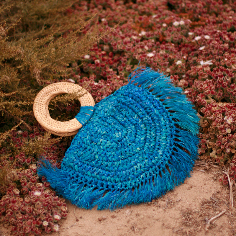 BrunnaCo Beach Raffia halfmoon bag with rattan handle made by artisans in Bali